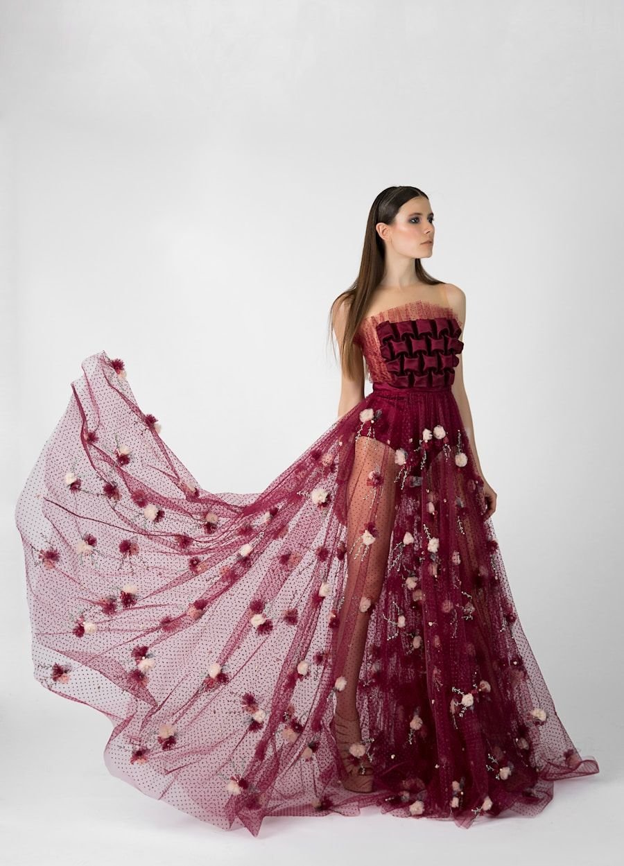 Long silk gown caught mid-movement, the skirt sweeping across a pale studio floor